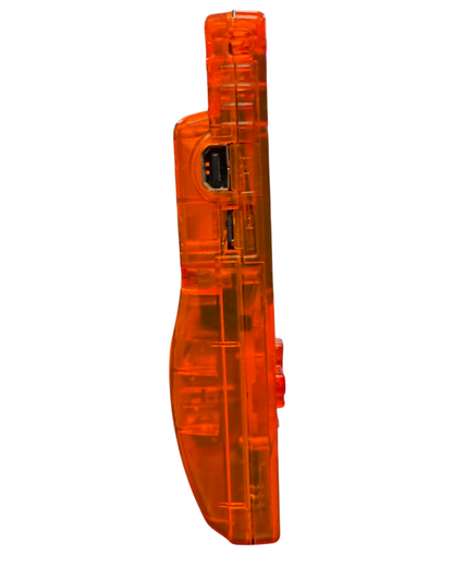 Side view of a clear orange custom Nintendo Game Boy Color handheld console showing the volume dial and transparent casing.