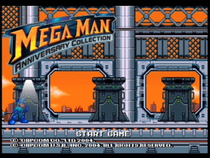 Mega Man Anniversary Collection PlayStation 2 (PS2) title screen showing classic characters and bold retro graphics.