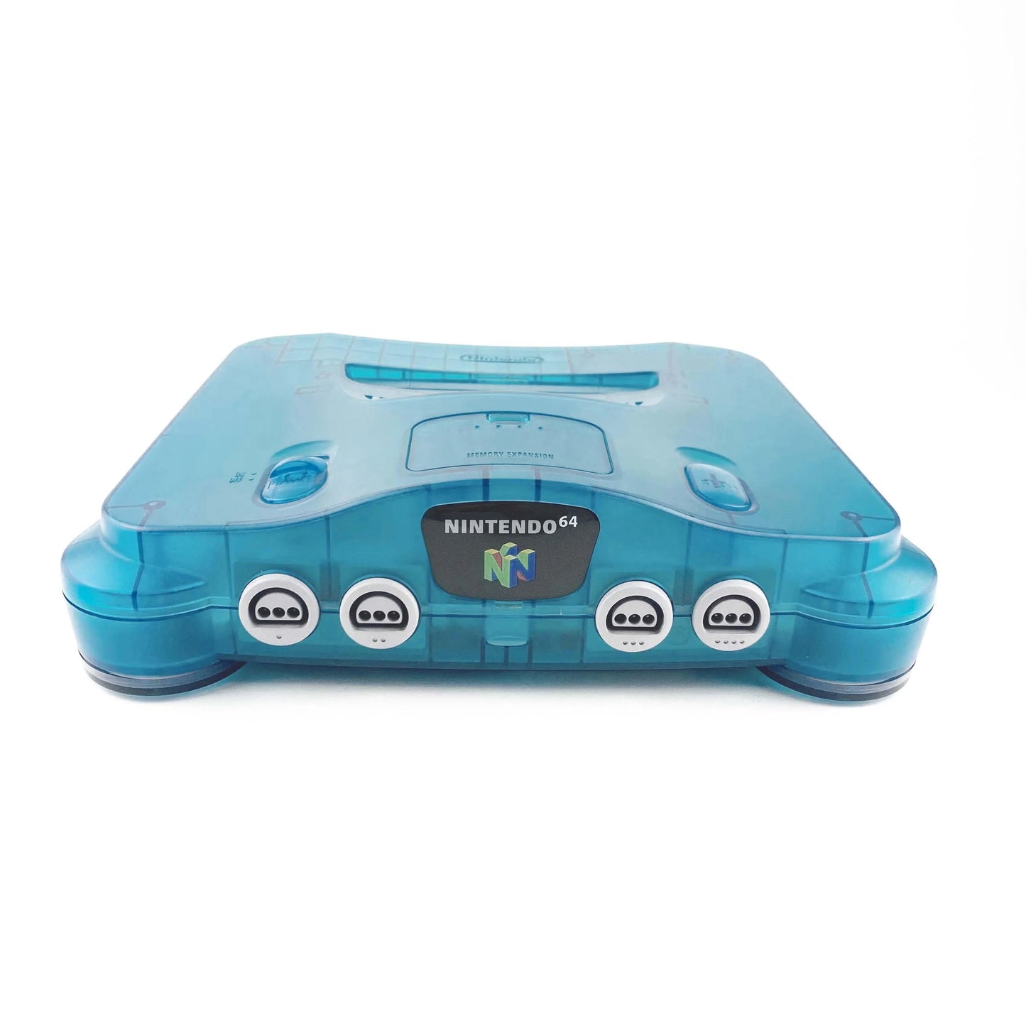 Nintendo 64 Console System (N64) Funtastic Ice Blue with Official Funtastic Ice Blue Controller – Yellowed Condition at Gamers INC, featuring the iconic 64-bit powerhouse in its vibrant, translucent Ice Blue finish from the classic Funtastic series; despite its age-related yellowing, this bundle includes the matching official controller and delivers the authentic multiplayer magic of the N64 library, from Super Mario 64 to GoldenEye 007, in a collectible, retro-styled package front of console