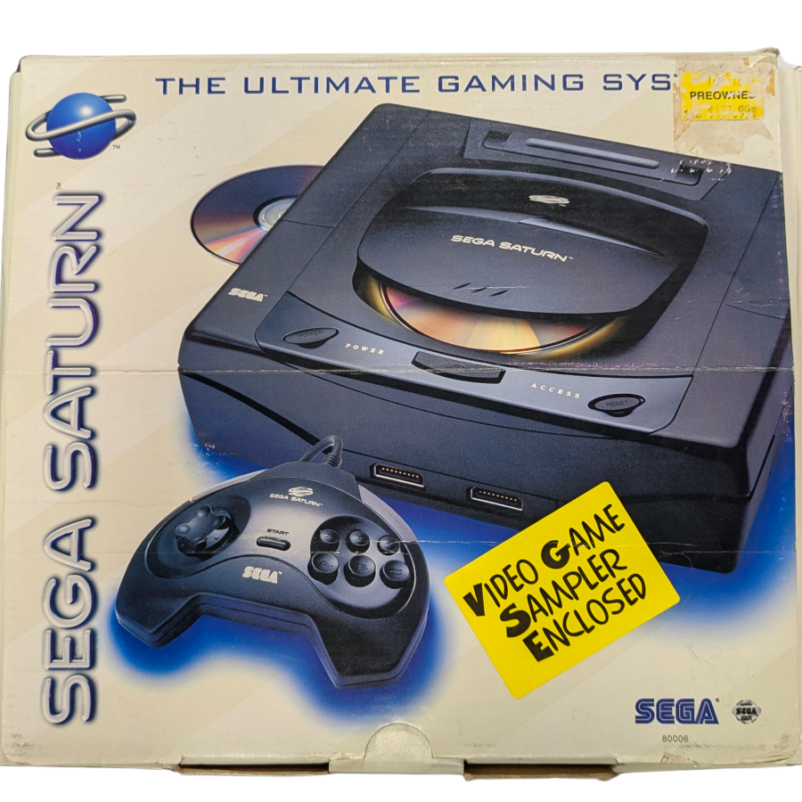 Sega Saturn Console (SS) [CIB] in good condition featuring Sega’s 32 bit CD based system known for excellent 2D arcade ports and a strong library of fighters shooters and RPGs; includes the original box and contents with the console showing overall good cosmetic condition front of real box