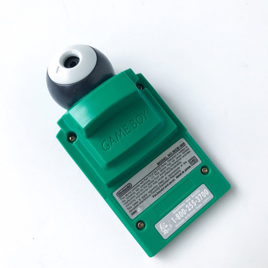 Green Game Boy Camera original Nintendo accessory for Game Boy featuring classic monochrome photography gameplay collectible retro handheld camera cartridge compatible with Game Boy systems