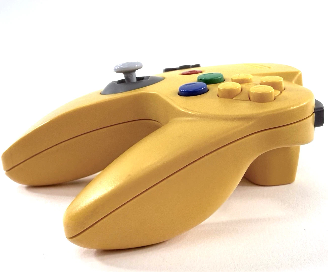 Nintendo 64 Controller Yellow OEM original first party controller for the Nintendo 64 featuring a bright yellow design with analog stick ergonomic three prong grip and responsive buttons for classic multiplayer gaming side 