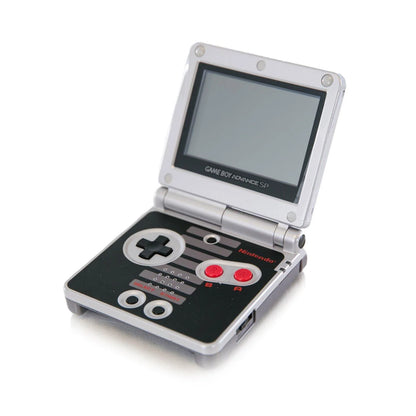 Game Boy Advance SP GBA SP AGS-101 NES Edition handheld gaming console featuring iconic NES inspired design bright backlit AGS-101 screen foldable clamshell form factor rechargeable battery Game Boy Advance and compatible Game Boy Color games portable gaming and visible scratches and scuffs collectible Nintendo hardware appeal front