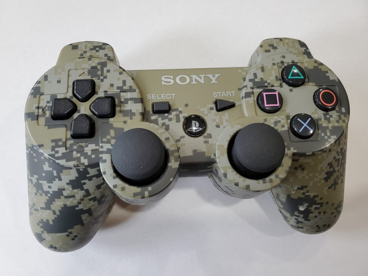 PS3 DualShock Controller – Digital Camo wireless gaming controller featuring:

DualShock vibration feedback for immersive force feedback during gameplay

Iconic Digital Camo camo-style design

Pressure sensitive buttons & dual analog sticks for precise control

Built-in Sixaxis motion sensing support

Compatible with PlayStation 3 games

A great accessory to enhance your PS3 gaming experience with reliable ergonomics and responsive controls.