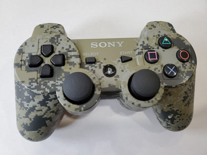 PS3 DualShock Controller – Digital Camo wireless gaming controller featuring:

DualShock vibration feedback for immersive force feedback during gameplay

Iconic Digital Camo camo-style design

Pressure sensitive buttons & dual analog sticks for precise control

Built-in Sixaxis motion sensing support

Compatible with PlayStation 3 games

A great accessory to enhance your PS3 gaming experience with reliable ergonomics and responsive controls.