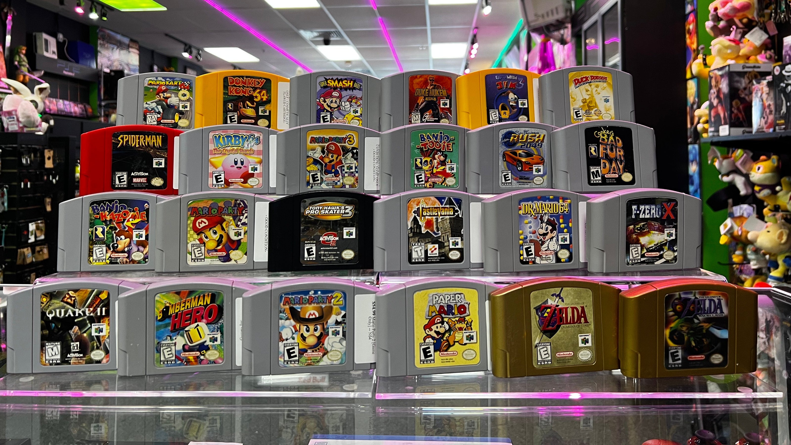 Collection of Nintendo 64 games displayed in a store setting with colorful lighting at Gamers Inc Orlando Gamers Go Retro