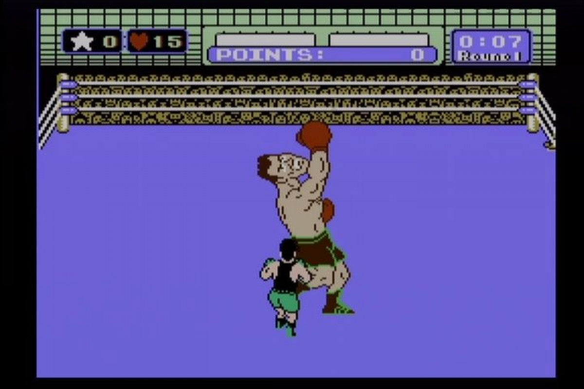 Punch Out Nintendo Entertainment System NES video game featuring boxing sports gameplay Little Mac boxing matches opponent battles dodging punches counter attacks knockout challenges training and classic 8 bit Nintendo arcade sports gameplay retro video game collection collectible gaming appeal gameplay