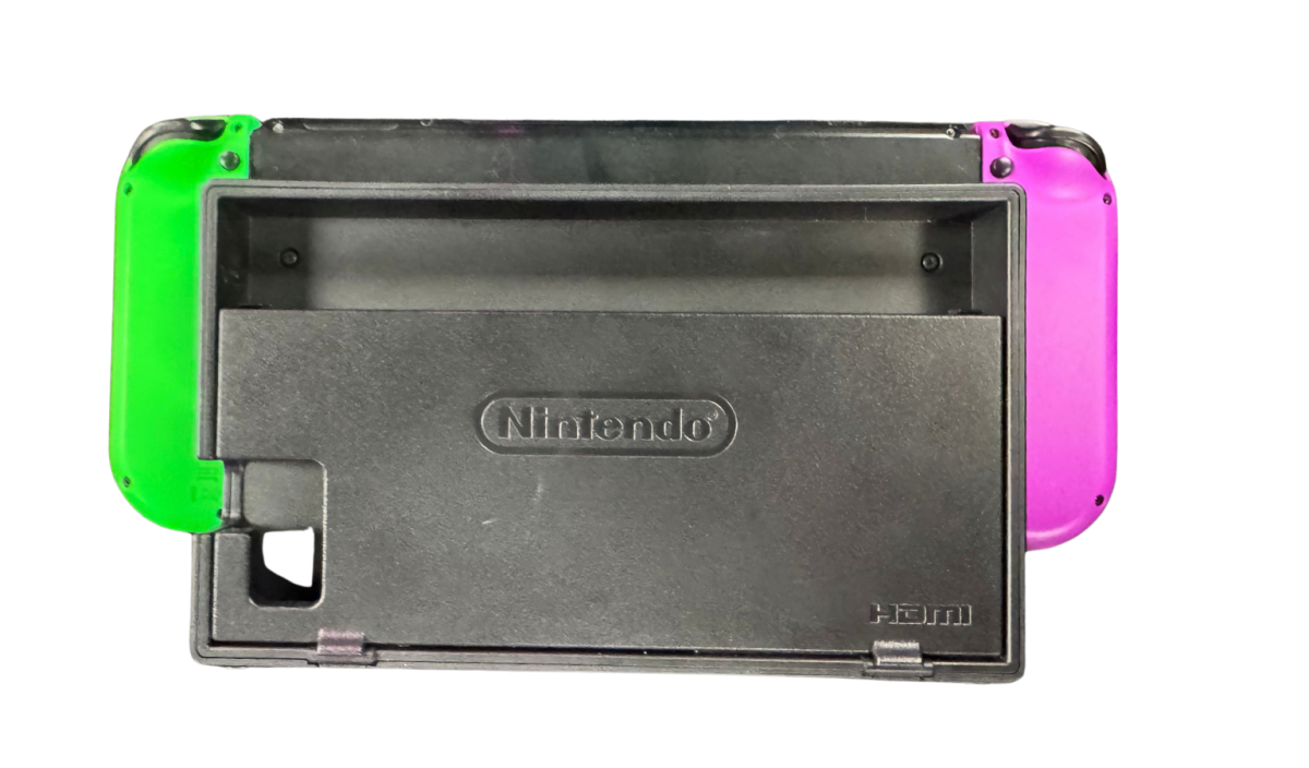 Nintendo Switch System NS with Dock Green and Purple Joy Cons Scratch and Scuff Condition Nintendo hybrid gaming console handheld and TV play modes detachable Joy Con controllers touchscreen display multiplayer gaming dock included colorful controller design used Nintendo gaming system console hardware collectible gaming setup appeal bakc