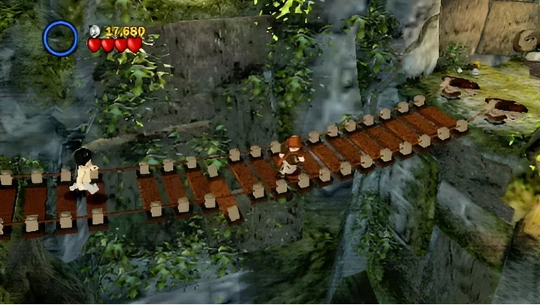 LEGO Indiana Jones The Original Adventures PlayStation Portable box art displaying the adventurous Lego minifigure and action scenes gameplay screenshot