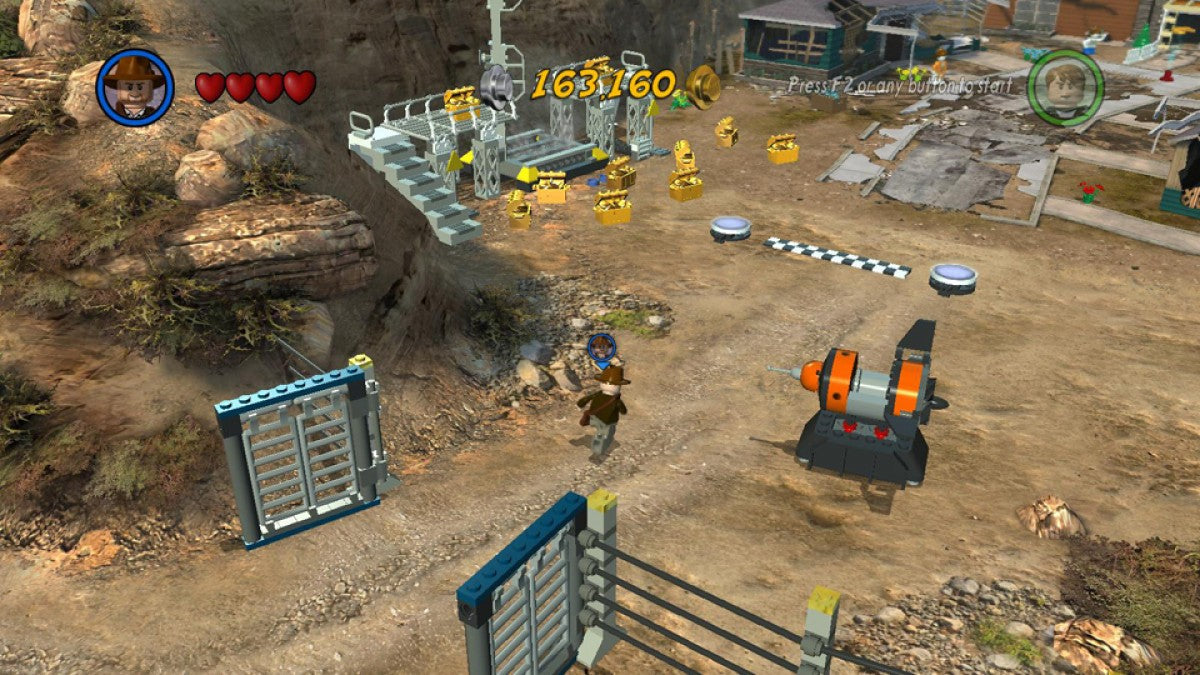LEGO Indiana Jones 2 The Adventure Continues PlayStation 3 action-adventure sequel featuring the original trilogy plus Crystal Skull content level creator brick-building puzzle solving humor Indiana Jones Marion characters cooperative gameplay screenshot