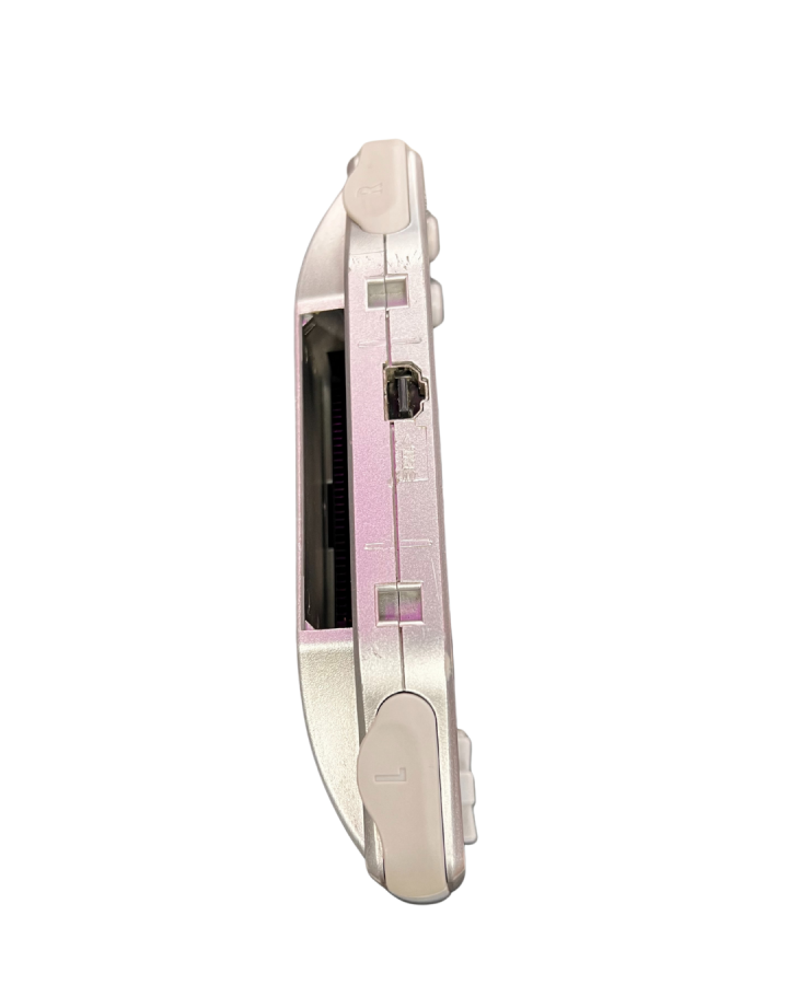 Top-down view of a platinum Game Boy Advance console showing the cartridge slot opening at the top edge of the metallic silver casing.
