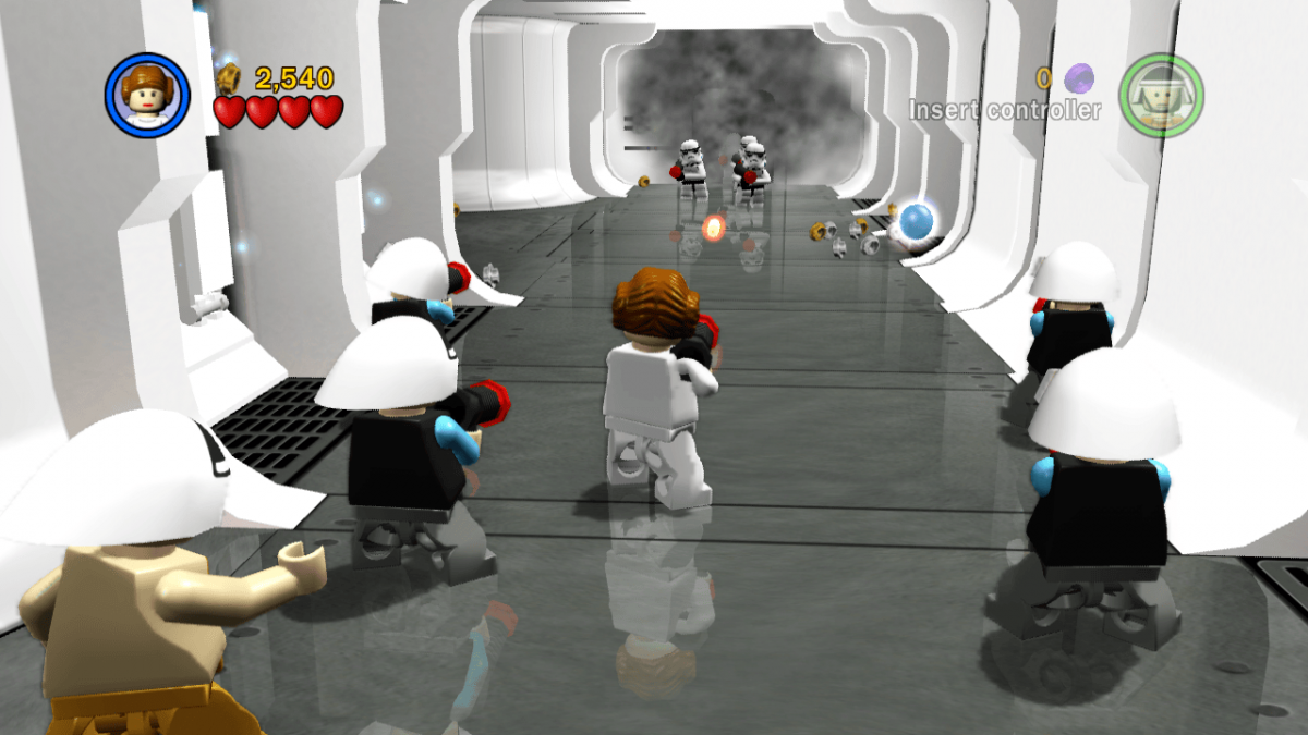 LEGO Star Wars The Complete Saga game featuring action adventure gameplay with LEGO style humor covering Episodes I through VI with character switching puzzle solving cooperative multiplayer and exploration across iconic Star Wars locations gameplay 