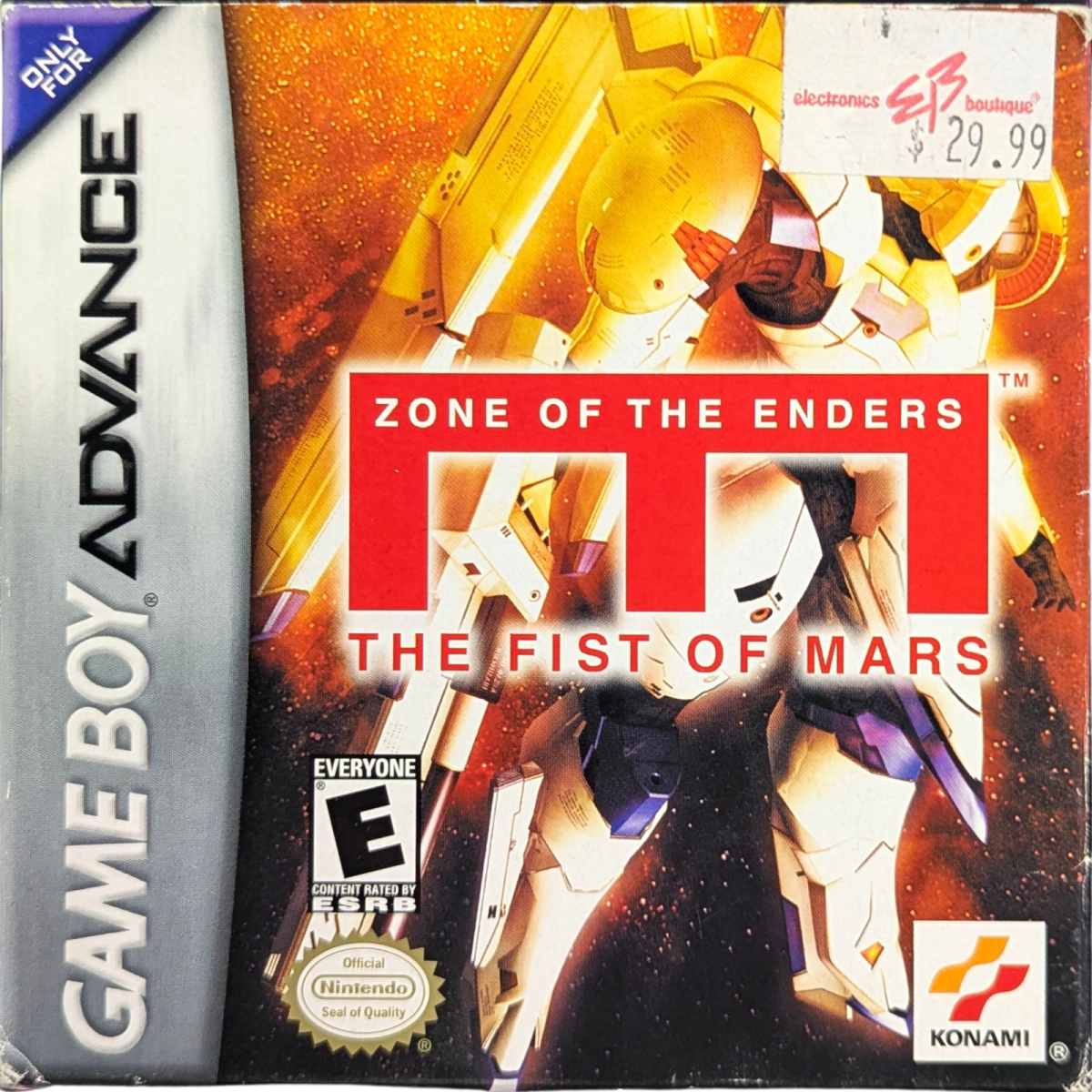 Zone of the Enders: The Fist of Mars [CIB] for Game Boy Advance (GBA) featuring a story-driven tactical RPG spin-off with turn-based mech battles set in the Z.O.E. universe; command your squad, customize Orbital Frames, and follow an anime-style narrative in this complete-in-box handheld entry front cover