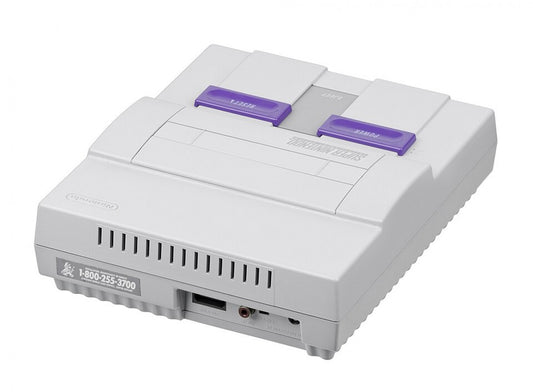 Back view of the original Super Nintendo Entertainment System (SNES) console showing power input, AV output, RF port, and expansion slot.