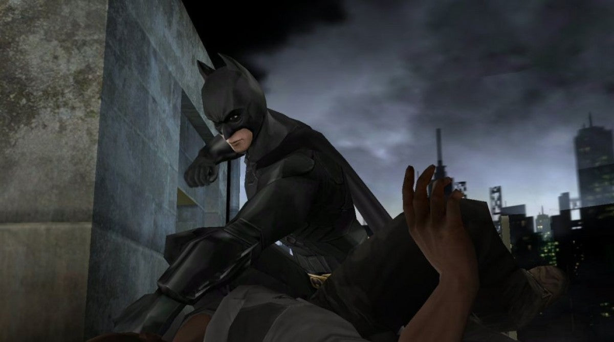 Batman Begins for PlayStation 2 with dark action-adventure theme based on the film gameplay