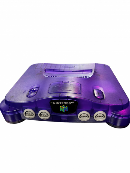 Front view of a Funtastic grape purple Nintendo 64 console showing its translucent shell and controller ports.
