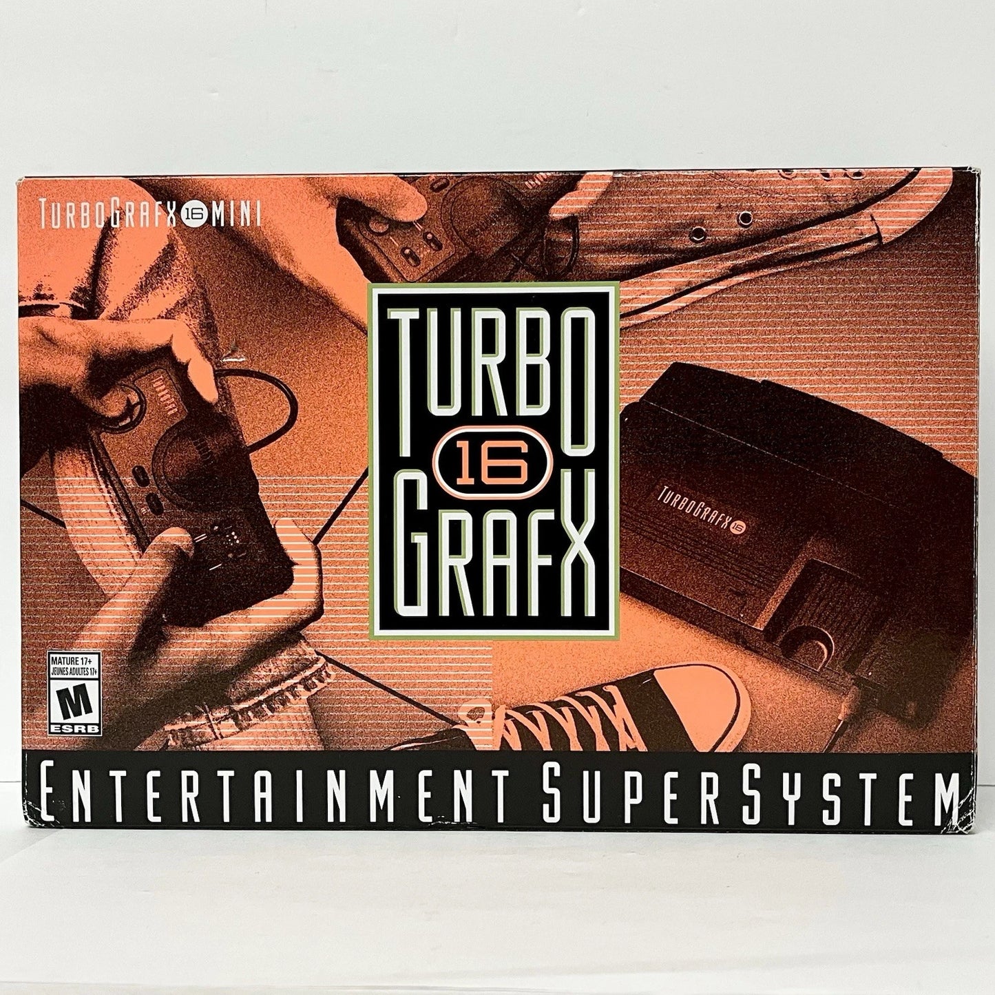 TurboGrafx-16 System (TG16) with Turbo Booster featuring NEC’s 16 bit era console for HuCard games paired with the Turbo Booster add on for composite A V output and system expansion; enjoy classic arcade style action and shooters with the enhanced setup for playing on modern TVs front box