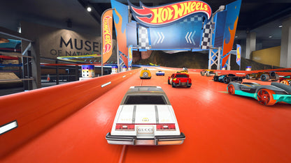 Hot Wheels Unleashed Nintendo Switch inspired design featuring high speed arcade racing aesthetic miniature die cast vehicles gravity defying tracks thrilling stunts competitive multiplayer action vibrant environments and fast paced racing gameplay presentation gameplay 