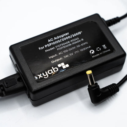 XYAB brand AC adapter and charger compatible with all PlayStation Portable (PSP) models for powering and charging handheld consoles