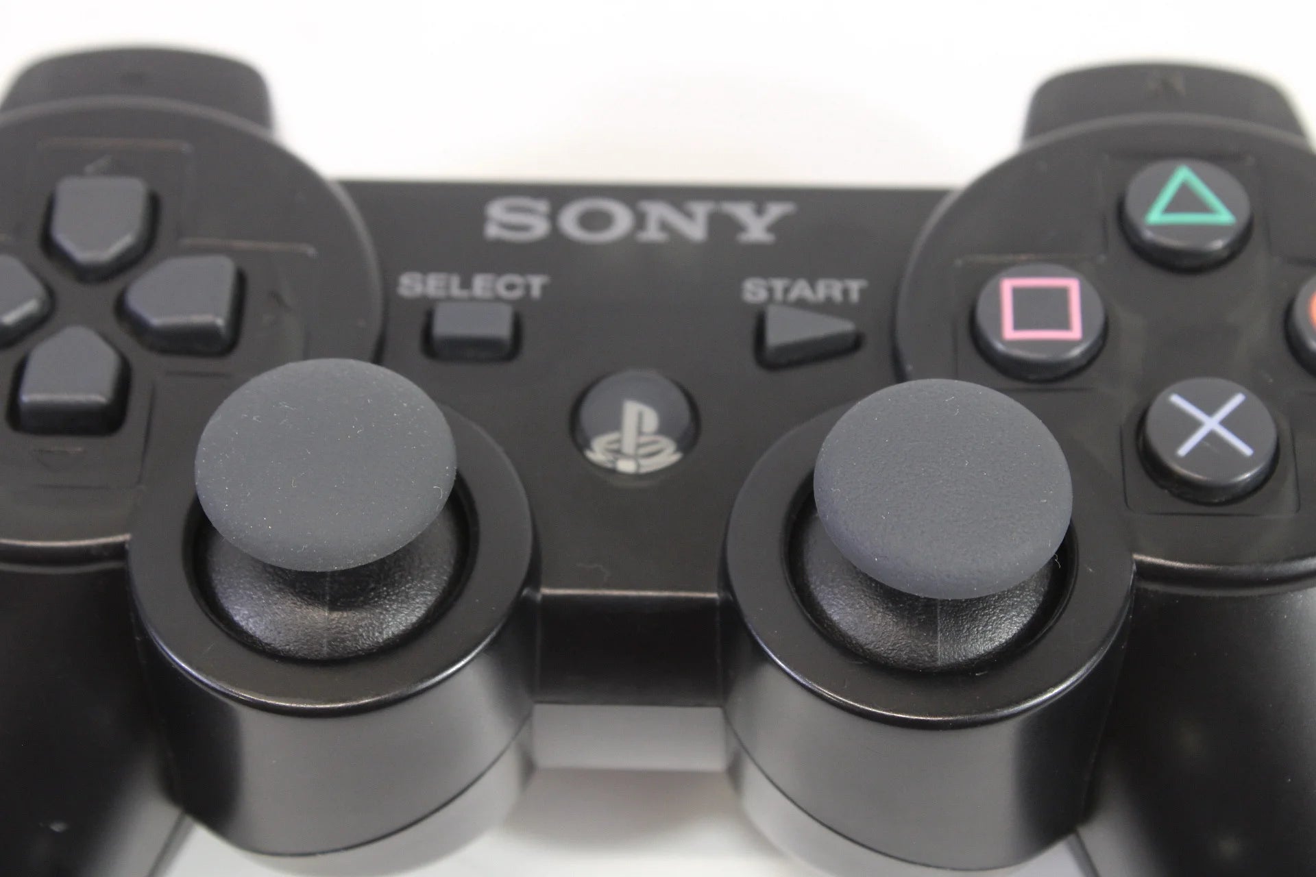 PlayStation 3 DualShock 3 OEM Black accessory PlayStation 3 (PS3) close up of sticks