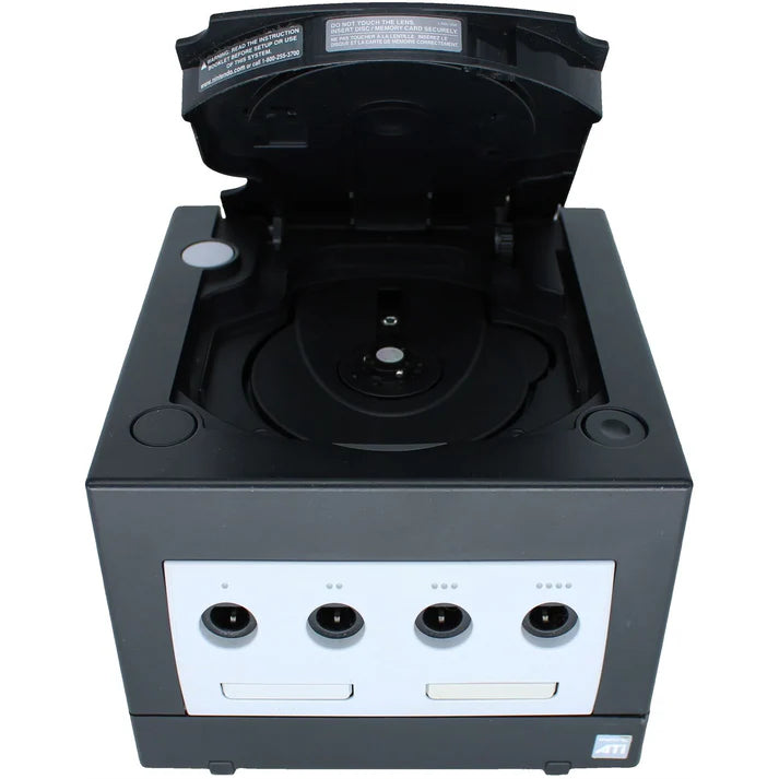 Front view of a black Nintendo GameCube console with the disc cover open, showing the game disc compartment above the controller ports.