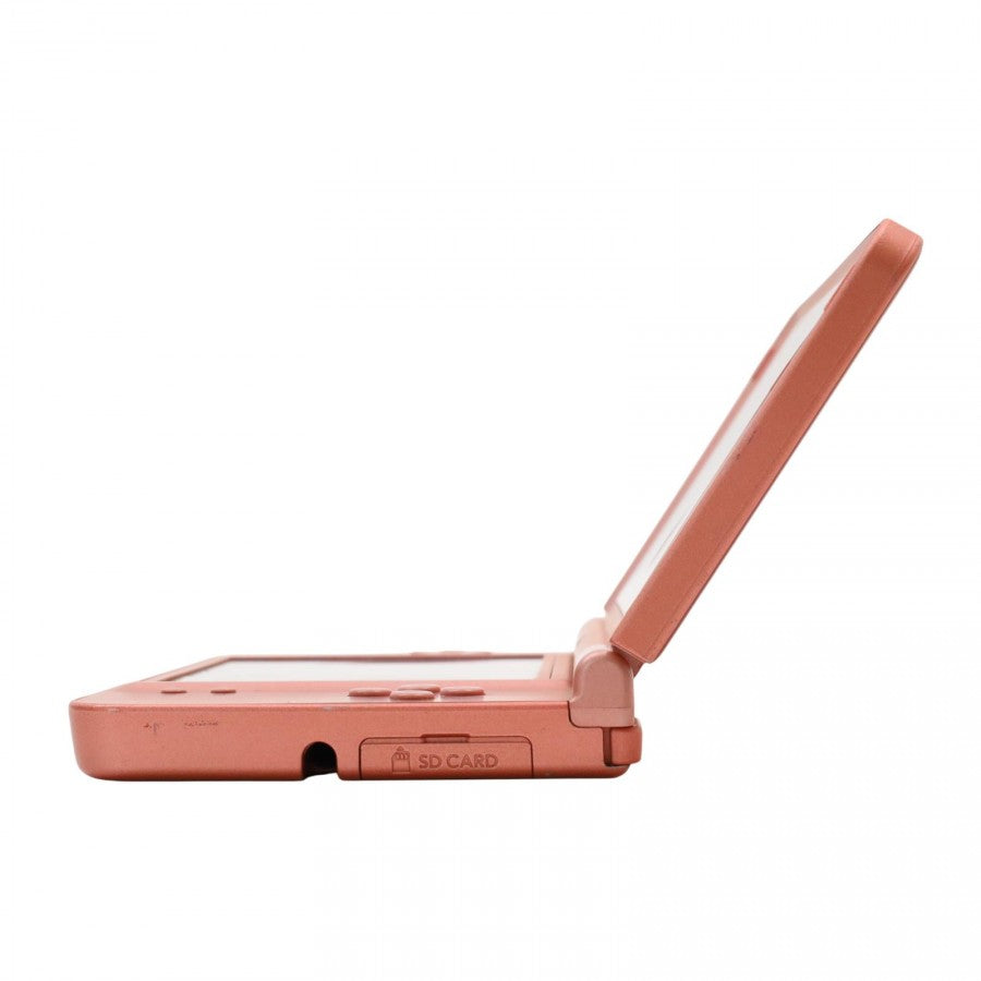 Side view of the opened Nintendo DSi XL in rose pink showing hinge, screen thickness, and button layout