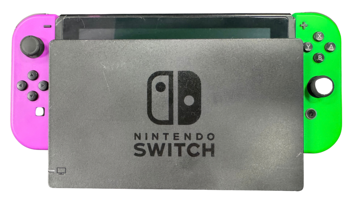 Nintendo Switch System NS with Dock Green and Purple Joy Cons Scratch and Scuff Condition Nintendo hybrid gaming console handheld and TV play modes detachable Joy Con controllers touchscreen display multiplayer gaming dock included colorful controller design used Nintendo gaming system console hardware collectible gaming setup appeal front