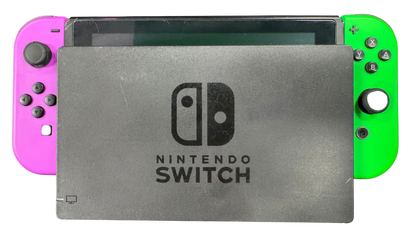 Nintendo Switch System NS with Dock Green and Purple Joy Cons Scratch and Scuff Condition Nintendo hybrid gaming console handheld and TV play modes detachable Joy Con controllers touchscreen display multiplayer gaming dock included colorful controller design used Nintendo gaming system console hardware collectible gaming setup appeal front