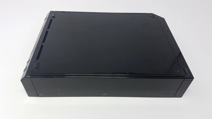 Black Nintendo Wii console positioned horizontally on its side, showing the front disc slot and button layout.