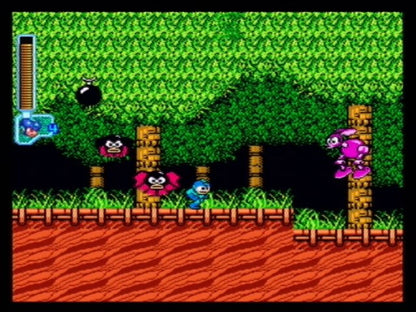 Mega Man Anniversary Collection PlayStation 2 (PS2) gameplay showing classic characters and bold retro graphics.