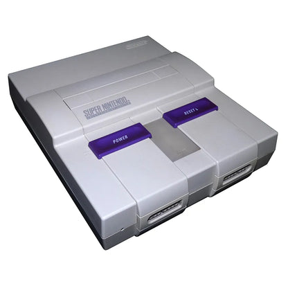 Front view of the original Super Nintendo Entertainment System (SNES) console with gray casing, purple power and reset switches, cartridge slot, and two controller ports.