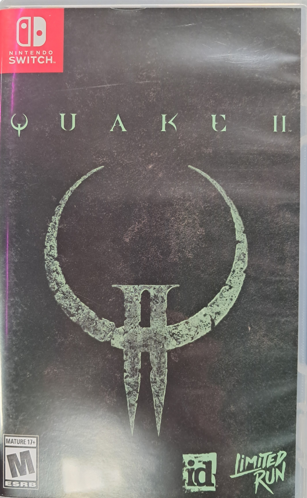 Quake II Nintendo Switch inspired design featuring sci fi first person shooter aesthetic futuristic military combat hostile alien Strogg forces fast paced action intense weapons based gameplay classic arena shooter revival modern enhanced presentation front cover