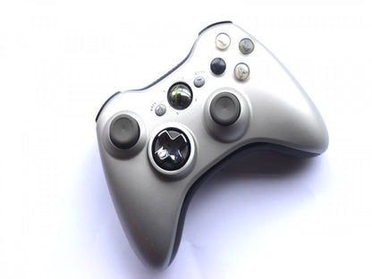 Silver Xbox 360 controller with ergonomic design and classic Xbox button layout