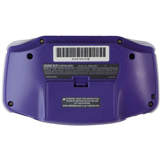 Back view of an indigo Game Boy Advance console showing its purple casing, battery cover, shoulder buttons, and cartridge slot.
