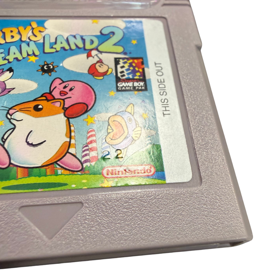 Kirby's Dream Land Game Boy GB for platforming video game fans featuring Kirby's classic adventure colorful levels power ups enemy abilities challenging boss battles side scrolling gameplay charming characters and classic Nintendo handheld gaming collectible retro Game Boy appeal authenticity stamp