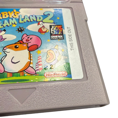 Kirby's Dream Land Game Boy GB for platforming video game fans featuring Kirby's classic adventure colorful levels power ups enemy abilities challenging boss battles side scrolling gameplay charming characters and classic Nintendo handheld gaming collectible retro Game Boy appeal authenticity stamp