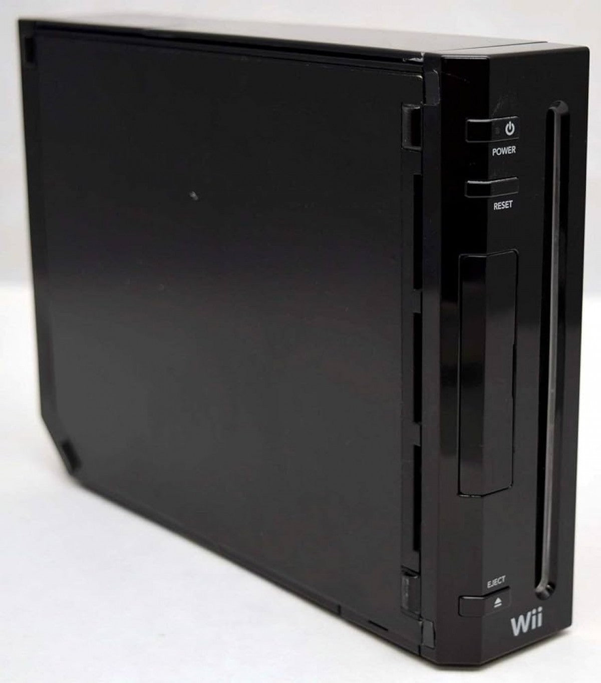 Angled front view of a black Nintendo Wii console standing vertically, highlighting the disc slot and front panel buttons.