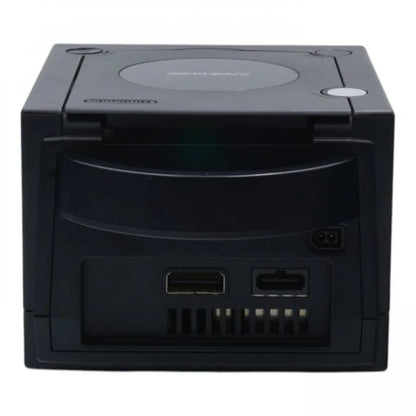 Rear view of a black Nintendo GameCube console showing power input, AV output, digital output port, and ventilation grille.